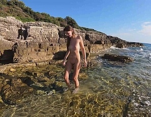 072922_rebeka_ruby_nude_on_a_beach_walking_in_the_water_searching_for_interesting_shells